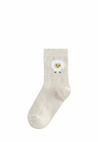 Beige bavlněná ponožka s nadýchaným designem bílého ovce, s žlutou tváří a černýma nohama. Hladký povrch, žebrovaný lem.
