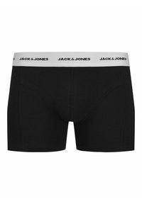 Schwarze Baumwoll-Boxershorts mit einem weißen elastischen Bund, auf dem der Markenname "JACK & JONES" in Schwarz gedruckt ist. Sportlicher Schnitt.