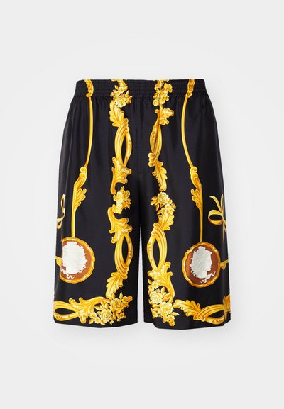 Μαύρο σορτς με ένα ζωντανό, περίπλοκο χρυσό σχέδιο, με λουλούδια και κυκλικά στοιχεία, κατασκευασμένο από ελαφρύ υλικό.