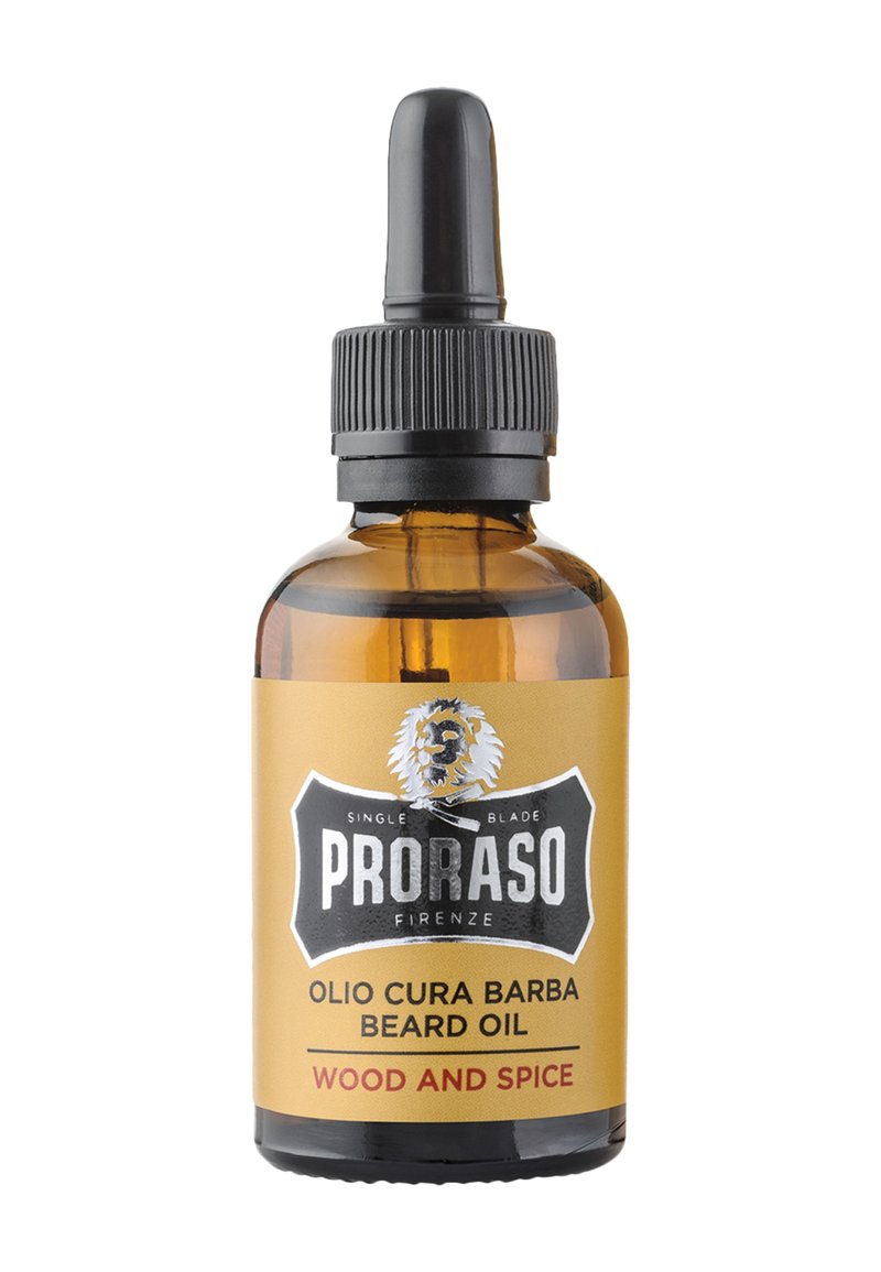 Kopparfärgad glasflaska med ett svart pipettlock. Etiketten har svarta och guldiga färger, en lejonlogotyp och texten "Proraso Olio Cura Barba Beard Oil."