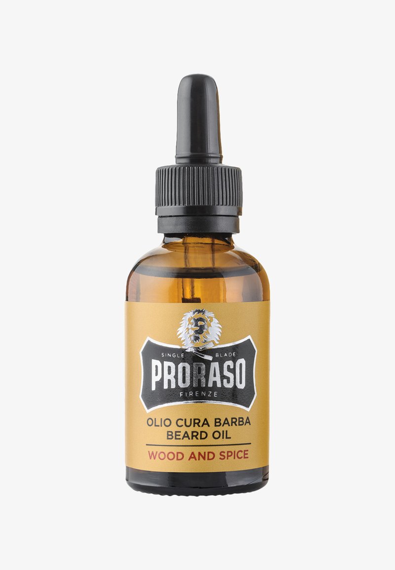 Bernsteinfarbenes Glasfläschchen mit schwarzem Tropfverschluss. Gold- und schwarzes Etikett mit der Aufschrift "PRORASO" und "WOOD AND SPICE" sowie einem Löwengrafik.