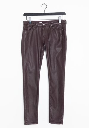 Burgundy slim-fit jeans made of denim, featuring five pockets, a metal button and zipper closure, and a slight sheen to the fabric.