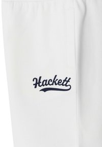 Pantalones deportivos blancos con un pequeño logo "Hackett" en azul marino bordado en el lado izquierdo, con cintura elástica y bolsillo lateral.