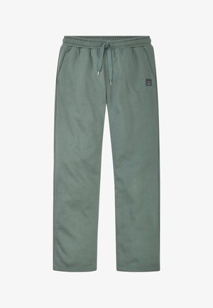 Grüne Jogginghose mit Kordelzug, elastischem Bund, seitlichen Taschen und kleinem schwarzem Logoaufnäher am rechten Oberschenkel.