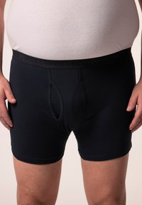Boxershorts in donker marineblauw katoen met een aansluitend ontwerp, voorzien van een elastische tailleband met subtiel logo en een opening aan de voorkant.