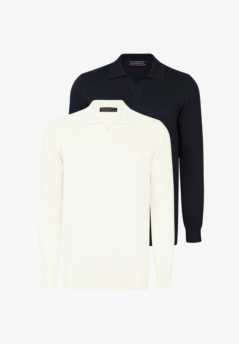 Två långärmade polo-tröjor, en gräddfärgad och en marinblå, med kragade halsar och en mjuk textur. Etiketter synliga vid halsringningen.