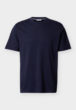 Camiseta de algodón azul marino de manga corta con cuello redondo y pequeño logo "ck" bordado en el pecho izquierdo.