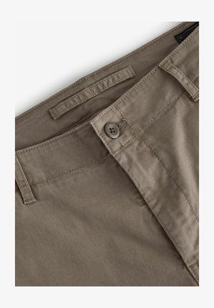 Beige cotton trousers with a smooth texture, featuring a button closure and belt loops. Subtle stitching details along the waistband.