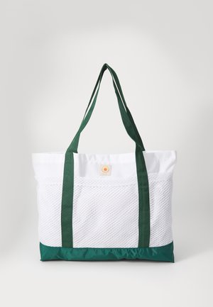 Torba za nošenje s bijelim mrežastim tijelom, donjim dijelom od zelene najlonske tkanine i ručkama. Sadrži kružni logo sprijeda. Prostoran i lagan dizajn.