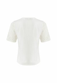 Chemise blanche à manches courtes avec un corps uni et des manches en dentelle. Tissu doux avec un col rond et une coupe décontractée.