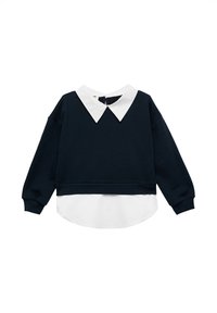 Granatowy krótki sweatshirt z białą, odpinaną koszulą pod spodem, z długimi rękawami i ściągaczami na końcach. Gładka faktura.