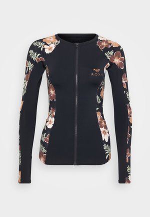 Top anti-UV à manches longues noir avec motifs floraux dans des nuances de marron, orange et vert. Doté d'une fermeture éclair à l'avant et du logo Roxy sur la poitrine.