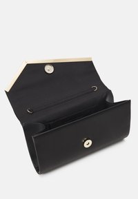 Black leather clutch with a sleek design, gold metal accents, a button closure, and an interior pocket for organization. Opens wide for easy access.