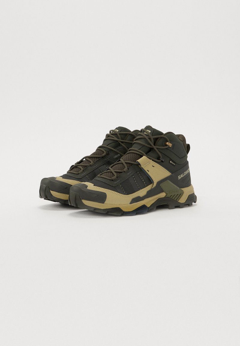 Black and olive hiking shoes with breathable mesh upper, rubber outsole, padded collar, and reinforced toe cap; features bungee laces.