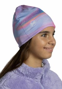 Lightweight purple beanie with abstract galaxy pattern in pink and blue, made from stretchy fabric, featuring a small Buff logo on the front.