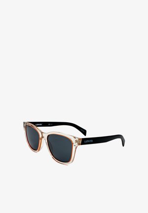 Occhiali da sole con montatura frontale marrone traslucida e aste nere, lenti scure e logo Levi's sulle aste.
