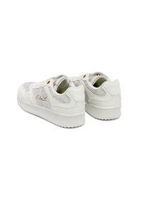 White sneakers featuring a textured upper design, with a smooth leather finish, subtle detailing, and a cushioned sole for comfort.
