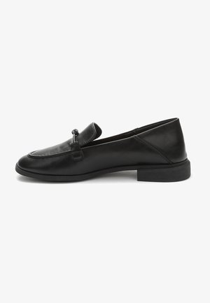 Black leather loafer with a rounded toe, stitched accents, and a small decorative strap. Flat rubber sole with a slight heel.