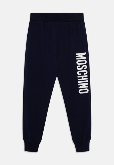 Mornarske trenirke s elastičnim pojasom i manžetama. "MOSCHINO" logo ispisan u bijeloj boji duž lijeve nogavice. Glatka tekstura, ležeran dizajn.