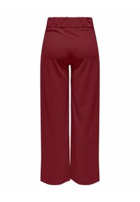 Elastische taillebrede palazzo-broek van effen bordeauxrood stof. Gladde textuur, geen zichtbare patronen of beslag, op maat gemaakt voor een losse fit en comfort.