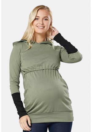 Maternity hoodie in olive green with a gathered waist, contrast black sleeves, and a hood. Soft fabric and relaxed fit for comfort.