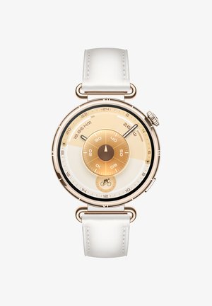 Runde Uhr mit Gehäuse aus goldfarbenem Metall, weißem Lederarmband und einem Ombre-Zifferblatt mit konzentrischen Kreisen in Gold- und Beigetönen.