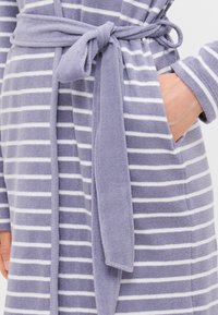 Purple striped bathrobe with white stripes, made of soft, textured fabric. Features a tied belt and two side pockets.