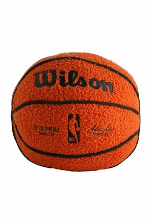 Orange Wilson basketball with black lines, NBA logo, and official game ball text on a textured surface against a white background.