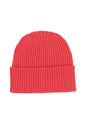 Red ribbed knit beanie hat with folded cuff and small round metal logo badge on the cuff’s right side.