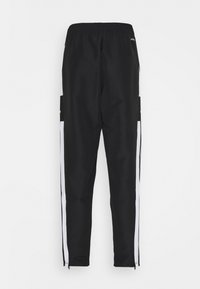 Sorte sportsbukser med hvide sidestreger, elastisk talje og lynlåse ved benene. Glat tekstur og tapered fit designet for komfort.