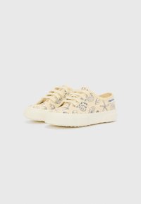 Gule lerrets Sneakers med et mønster som viser skjell og marineliv. Gummisåle, rund tå og snøring.