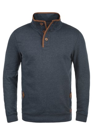 Marineblauer Pullover mit hohem Kragen, braunen Akzenten am Kragen und an den Knöpfen sowie strukturiertem Stoff. Verfügt über Seitentaschen und gerippte Bündchen.