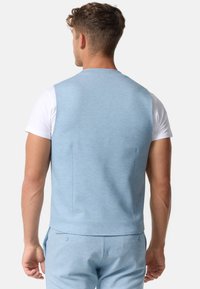 Light blue sleeveless vest made from textured fabric, featuring a smooth back and tailored fit, paired with matching trousers.