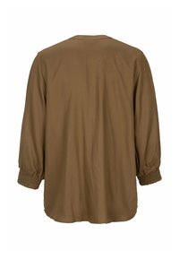 Brun, løsstående bluse med trekvartærmer. Har smockede manchetter og en simpel rund halsudskæring. Blødt, struktureret stof.