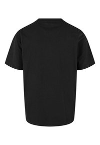 Svart bomulls T-skjorte, korte ermer, rund hals, myk tekstur og enkel design. Bakfra vises en glatt, ubehandlet overflate.