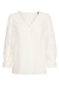 Weißes Blusenshirt mit V-Ausschnitt, ausgestattet mit durchsichtigen Spitzenschulterpolstern und floralen Mustern sowie elastischen Bündchen. Glatte Stoffqualität mit lockerer Passform.