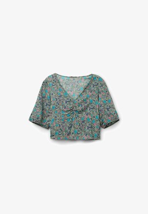 Cropped shirt in lightweight fabric with a turquoise, pink, and black floral paisley pattern. Features a V-neck and short sleeves.