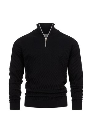 Pull en tricot noir avec un col montant, une fermeture éclair en métal argenté bien visible, un motif en chevrons texturé, et des bords côtelés aux poignets et à l'ourlet.