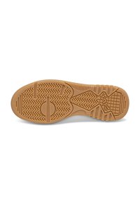 Kengän pohja, jossa on kumirakenne, herringbone-kuvio, pyöreät korostukset ja urat pidon parantamiseksi. Väri on vaalea beige.