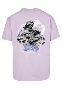Lilac short-sleeve T-shirt featuring a bold black and gray graphic design of two figures, with colorful accents and a lightning motif.