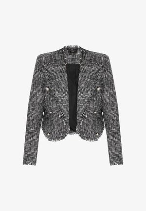 Sort og hvid tweedjakke med en frynset kant, struktureret form, nedlagt krave og dobbeltradet stil med dekorative knapper.