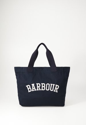 Navy blue canvas tote bag with two dark blue handles, featuring white "BARBOUR" text in an arched design across the front.