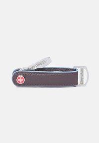 Brown leather key holder with a red cross emblem and silver metal hardware. Features a smooth texture and a simple, flat design.