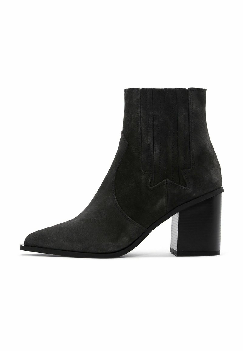 Black suede ankle boot with a pointed toe, textured side detailing, and a chunky black heel. Smooth finish with minimal accents.