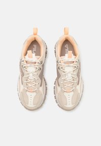 Lightweight sneakers featuring a beige and cream upper with mesh detailing, orange accents, reinforced toe, and a textured rubber sole.