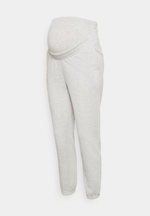 Pantalon de jogging de maternité gris clair avec taille élastique et poignets aux chevilles, conçu pour s'adapter confortablement à un ventre de femme enceinte.