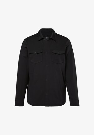 Sort skjorte med knapper lavet af glat stof, med krave, to brystlommer og lange ærmer med knapmanchetter.