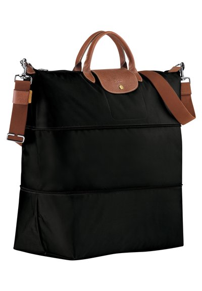 Schwarze Tragetasche aus Nylon mit braunen Ledergriffen und Akzenten. Verfügt über eine Fronttasche und einen verstellbaren Schulterriemen. Glatte Oberfläche.