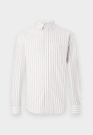 Gombos ing hosszú ujjakkal, függőleges rózsaszín és fehér csíkokkal, gallérral, elülső zsebbel és csíkos ujjvégződésekkel.