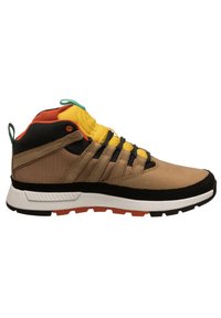 Mid-top sneaker with a beige and black synthetic upper, yellow and orange accents, textured panels, and a rugged sole featuring orange highlights.